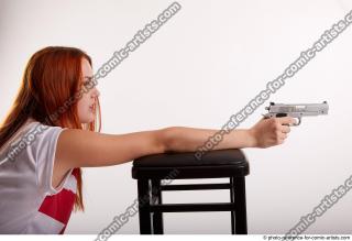 22 2018 01 TINA KNEELING POSE WITH GUNS